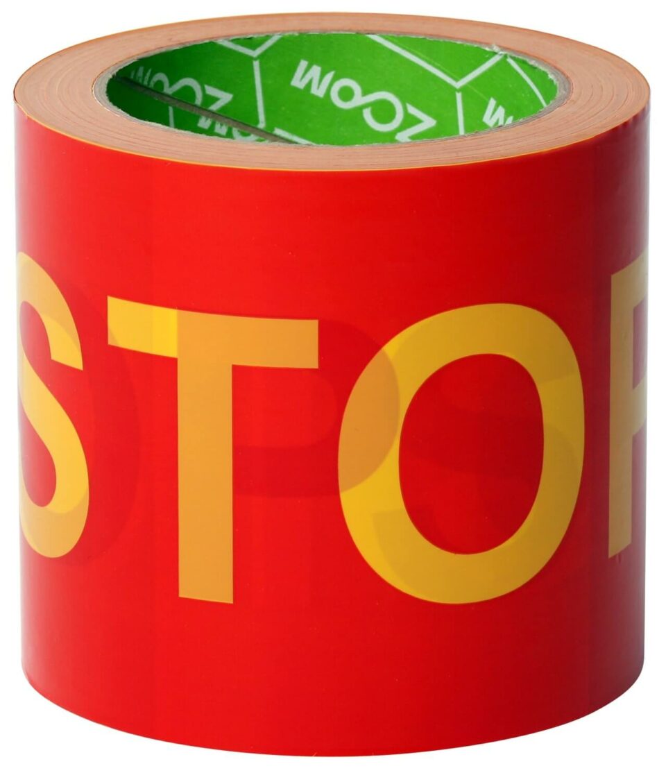 ZOOM STOP warning tape, red background, yellow letters